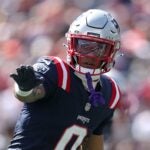FOXBOROUGH, MASSACHUSETTS - SEPTEMBER 28: Christian Gonzalez #0 of the New England Patriots signals against the Carolina Panthers during the first quarter in the game at Gillette Stadium on September 28, 2025 in Foxborough, Massachusetts.