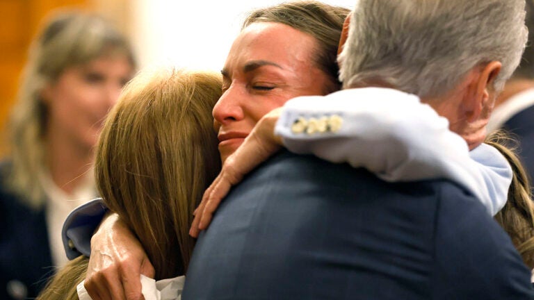 Karen Read hugs her parents Janet and William after the verdict.
