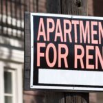 An apartment for rent sign.