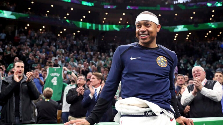 Denver Nuggets guard Isaiah Thomas smiles as fans applaud during a video tribute during a break in the first quarter of an NBA basketball game against the Boston Celtics in Boston, in this Monday, March 18, 2019, file photo. Two-time NBA All-Star Isaiah Thomas hopes playing this weekend with USA Basketball in FIBA AmeriCup qualifying in Puerto Rico gives an NBA club reason to sign him.