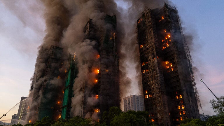 Smoke rises after a fire broke out at Wang Fuk Court, a residential estate in the Tai Po district of Hong Kong's New Territories.