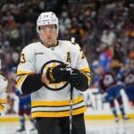 Boston Bruins defenseman Charlie McAvoy (73) in the third period of an NHL hockey game Saturday, Oct. 18, 2025, in Denver.