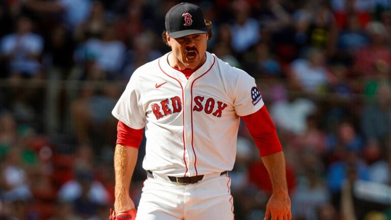Payton Tolle yells in excitement after getting the last out in an inning of a baseball game.
