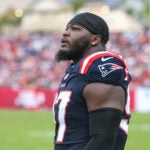 New England Patriots defensive end Milton Williams (97) walks the sideline during an NFL football game against the Tampa Bay Buccaneers, Sunday, Nov. 9, 2025, in Tampa, Fla. Patriots defeated the Buccaneers 28-23.