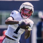 New England Patriots wide receiver Ja'Lynn Polk (1) makes a catch at the team's NFL football training camp, Wednesday, July 30, 2025, in Foxborough, Mass.