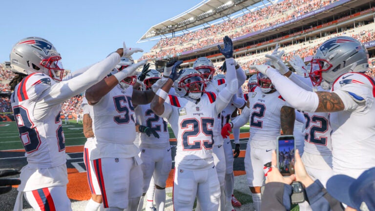 New England Patriots cornerback Marcus Jones #25 celebrates his pick six with teammates against the Cincinnati Bengals during second quarter NFL action at Paycor Stadium on November 23, 2025.