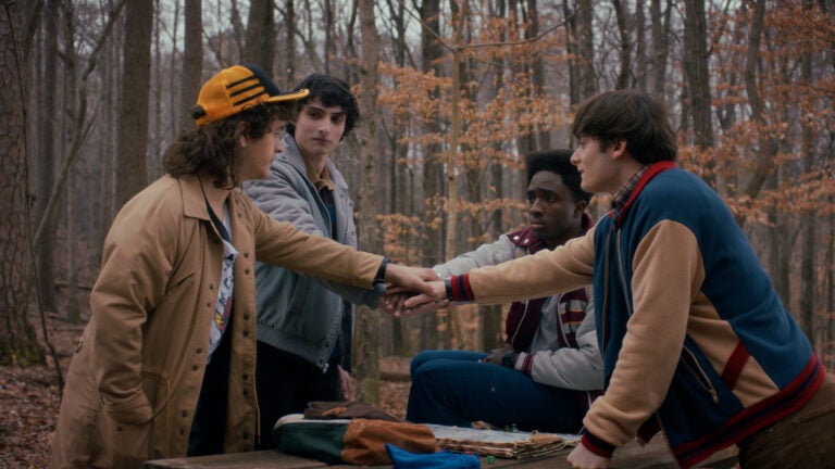 Stranger Things Season 5: Gaten Matarazzo as Dustin Henderson, Finn Wolfhard as Mike Wheeler, Caleb McLaughlin as Lucas Sinclair, and Noah Schnapp as Will Byers.