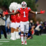 New England Patriots wide receiver Ja'Lynn Polk (1) reacts during player introductions before an NFL football game against the Houston Texans, Sunday, Oct. 13, 2024, in Foxborough, Mass.